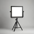 Modern LED light panel on tripod stand with minimalist gray background. Pro photography equipment for studio lighting. Adjustable Royalty Free Stock Photo