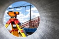 Modern level for geodesy at a construction site. Surveyors ensure precise measurements before undertaking large construction