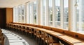 Modern Library or Study Area with Long Wooden Desk and Large Windows interior Royalty Free Stock Photo