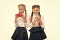 Modern life. Mobile addiction. Worldwide net. Internet resource has hazards for kids. Girls school uniform surfing