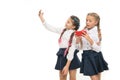 Modern life. Schoolgirls use mobile internet smartphone. School application smartphone. Mobile addiction. Worldwide net