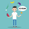 Modern lifestyle. Go vegan. Young bearded man juggling fruits an