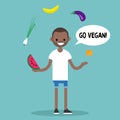 Modern lifestyle. Go vegan. Young black man juggling fruits and