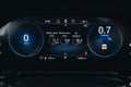 Modern light car black and blue mileage. Car dashboard with sensors and information.