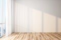 Modern light empty room with blank white wall, wooden floor and big window with city view Royalty Free Stock Photo