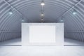 Modern light exhibition hangar interior with empty white poster on grey wall and concrete floor. Presentation concept. Mock up. 3D Royalty Free Stock Photo