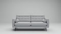 Modern Gray Sofa Couch with Button Tufting and Bolster Pillows on Gray Background Royalty Free Stock Photo