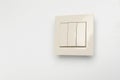 Modern light switch on white background. Space for text Royalty Free Stock Photo