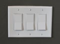 Modern light switches on a wall Royalty Free Stock Photo