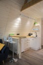 Modern little kitchen interior in a wooden house