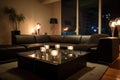 modern living room, with black leather sectional and glass coffee table, surrounded by candlelit ambiance