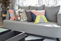 Modern living room design with colorful pillows on sofa Royalty Free Stock Photo