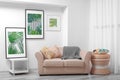 Modern living room design with framed pictures of leaves Royalty Free Stock Photo