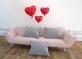 Modern Living Room design - pink sofa, pillow and balloons, wooden floor on empty white wall. 3D rendering