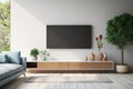 Modern living room features TV on cabinet against a blue wall Royalty Free Stock Photo