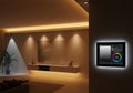 Modern living room featuring a smart wall control panel for lighting. The interior showcases Royalty Free Stock Photo