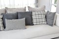 Modern living room interior with black and white checked pattern pillows Royalty Free Stock Photo