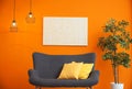 Modern living room interior with comfortable sofa near color wall Royalty Free Stock Photo