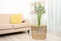 Modern living room interior with comfortable sofa and green bamboo Royalty Free Stock Photo