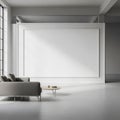 Modern living room with a large, empty white wall, featuring a minimalistic design. A gray sofa Royalty Free Stock Photo