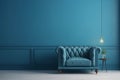 Modern living room with monochrome ocean blue empty wall. Contemporary interior design with trendy wall color and chair. Royalty Free Stock Photo