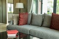 Modern living room with red pillows on sofa Royalty Free Stock Photo