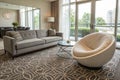 Modern living room with sofa, round chair and pattern carpet Royalty Free Stock Photo