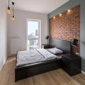 Bedroom with red, brick wall Royalty Free Stock Photo