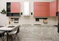 Modern loft style kitchen with hob, fume hood and table with countertop