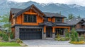 Modern log home nestled in a mountain valley Royalty Free Stock Photo