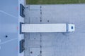 Modern logistics center, white van and trailers standingon ramp. Aerial View Royalty Free Stock Photo