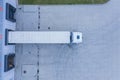 Modern logistics center, white van and trailers standingon ramp. Aerial View Royalty Free Stock Photo