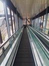 Modern long escalator in a train station