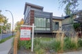 A modern looking house for sale during fall