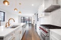 A modern luxurious kitchen with white and black cabinets. Royalty Free Stock Photo