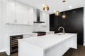 A modern luxurious kitchen with white and black cabinets. Royalty Free Stock Photo