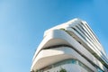 Modern, luxury apartment building against blue sky