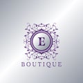 Modern Luxury Boutique Letter E logo. Unique elegance design floral ornament with purple metal circle frame vector design