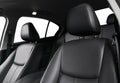 Modern luxury car black leather interior. Part of leather car seat details with stitching. Interior of prestige modern car. Comfor