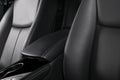 Modern luxury car black leather interior. Part of leather car seat details with stitching. Interior of prestige modern car. Comfor Royalty Free Stock Photo