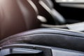 Modern luxury car black perforated leather interior. Part of leather car seat details. Modern car interior details. Car detailing. Royalty Free Stock Photo