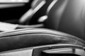 Modern luxury car black perforated leather interior. Part of leather car seat details. Modern car interior details. Car detailing. Royalty Free Stock Photo