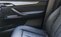 Modern luxury car black perforated leather interior. Part of leather car seat details. Modern car interior details. Car detailing. Royalty Free Stock Photo