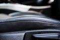 Modern luxury car black perforated leather interior. Part of leather car seat details. Modern car interior details. Car detailing. Royalty Free Stock Photo