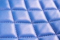 Modern luxury car blue leather interior. Part of perforated leather car seat details. Blue perforated leather texture background. Royalty Free Stock Photo