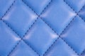 Modern luxury car blue leather interior. Part of perforated leather car seat details. Blue perforated leather texture background. Royalty Free Stock Photo