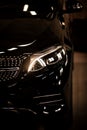 Modern luxury car close-up headlight.