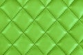 Modern luxury car green leather interior. Part of perforated leather car seat details. Green perforated leather texture background Royalty Free Stock Photo