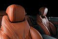 Modern Luxury car inside. Interior of prestige modern car. Comfortable leather red seats. Orange perforated leather cockpit with Royalty Free Stock Photo