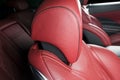 Modern Luxury car inside. Interior of prestige modern car. Comfortable leather red seats. Red perforated leather cockpit with Royalty Free Stock Photo